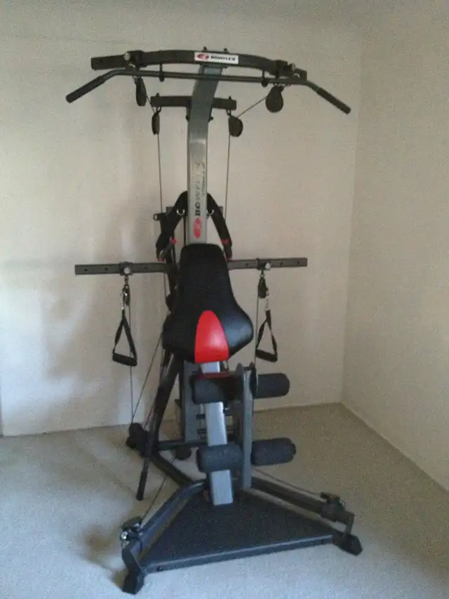 BowFleX Xtreme 2 Se with 310 Pounds gym weights exercise
