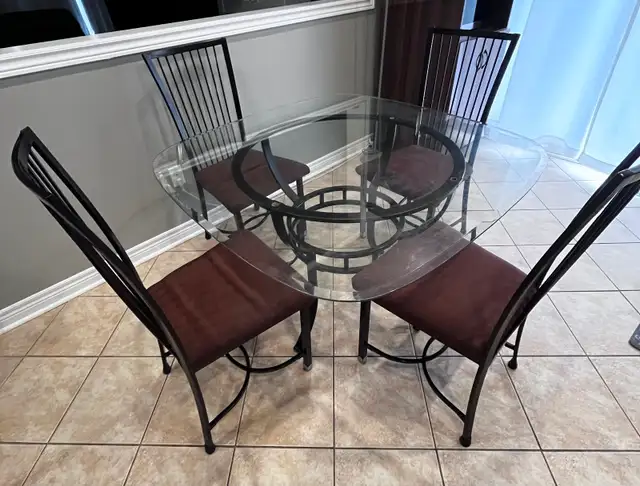 Glass top metal dining table with 3 chairs