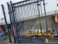 TWO 44' X 5' ROD IRON GATES WITH HARDWARE  $250.00
