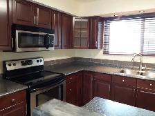 RENOVATED 3 BEDROOM   DEN TOWNHOUSE | 2 PARKING STALLS | FENCED - Photo 2