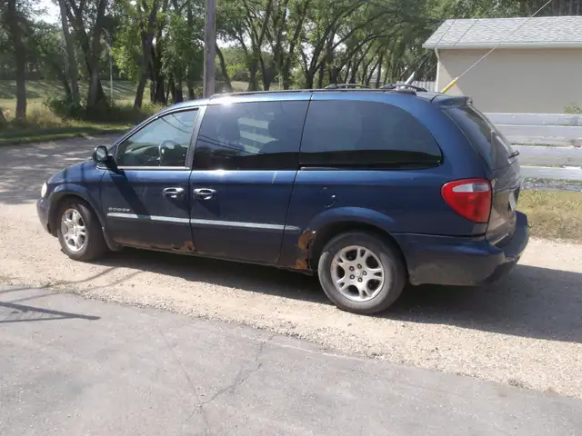 2001 Grand Caravan AWD 264K 3.6L Good driver,tires and glass.