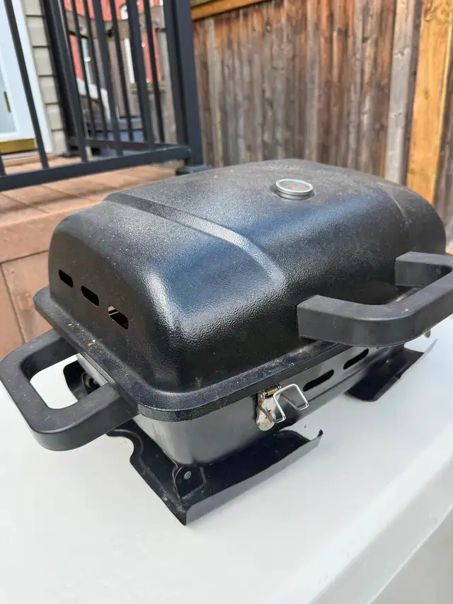 Portable Bbq. And Bbq Cover for a large Bbq