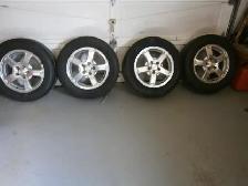 4-HANKOOK ALL SEASON TIRES AND RIMS P225 60R16 WITH SNOWFLAKE