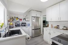 Beautifully updated 1531sqft 4bdrm home in the heart of West K! - Photo 5