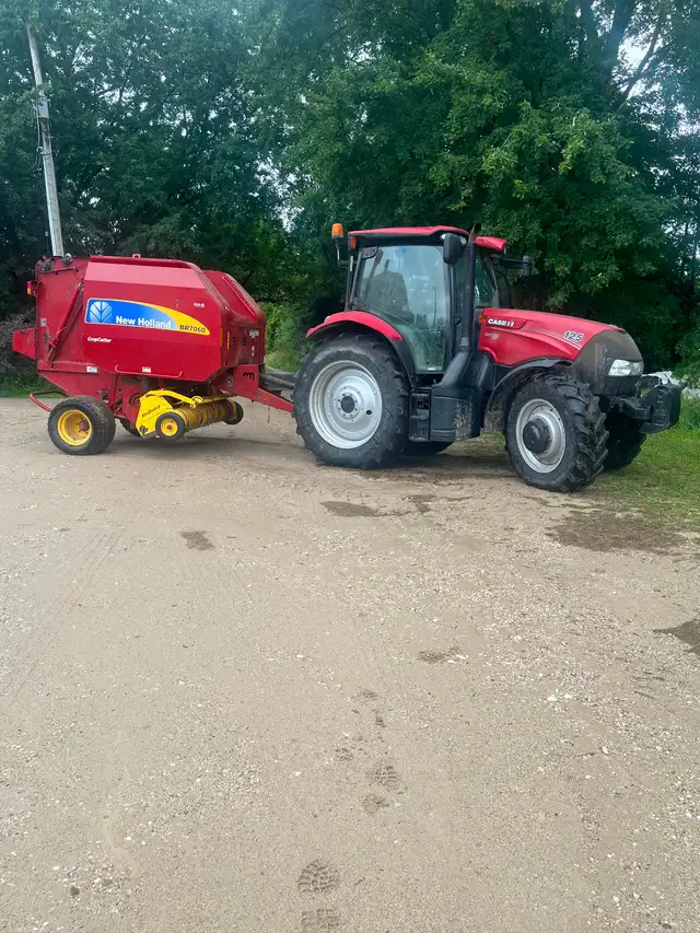 Custom round, bailing, cutting and wrapping and livestock trucki