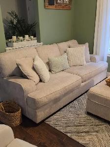cream coloured sofa& chair & 1/2 for sale with ottoman