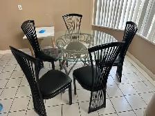 Glass table with chairs.