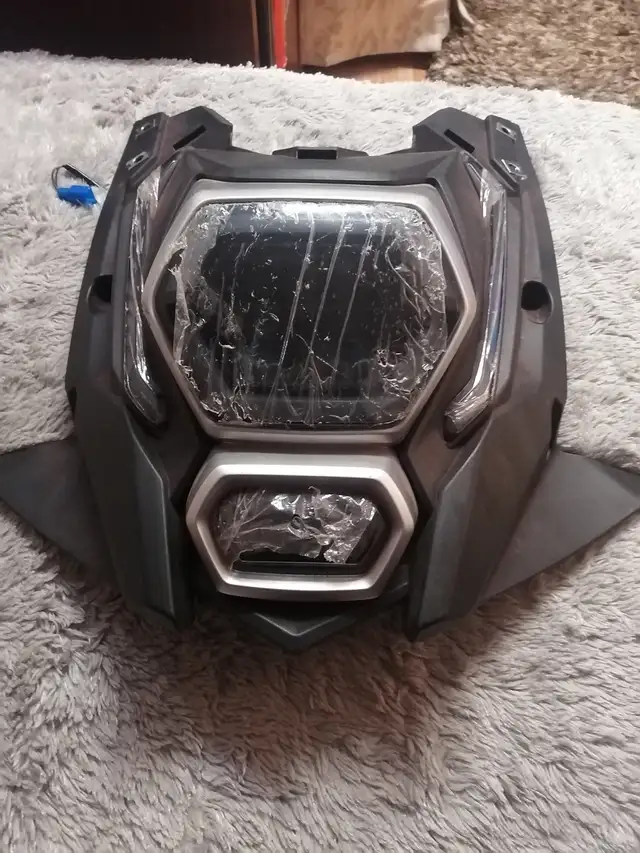 Headlight with black fairing mask for a dirt bike