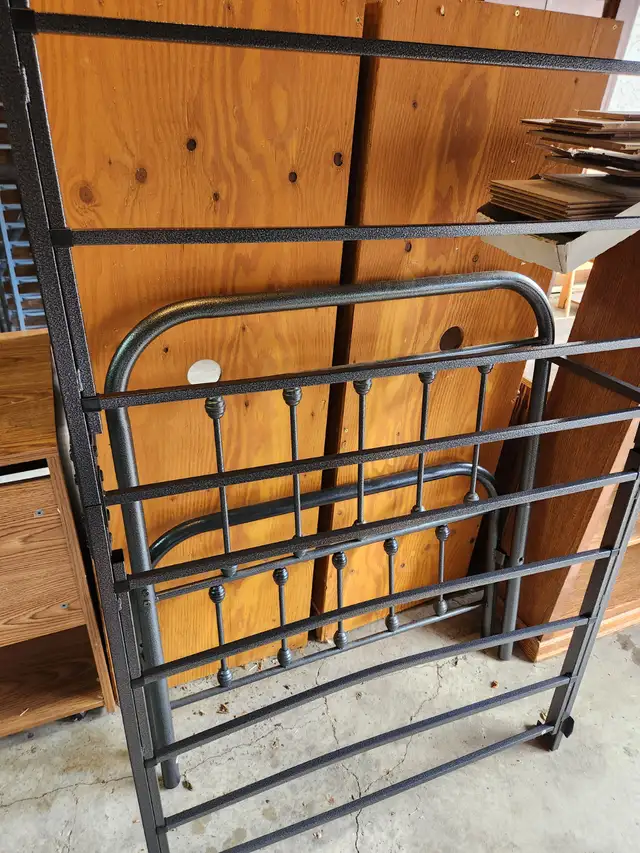 Black metal single bed frame