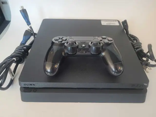 1TB Slim Sony PS4 w/Controlers and Cables (32672269)