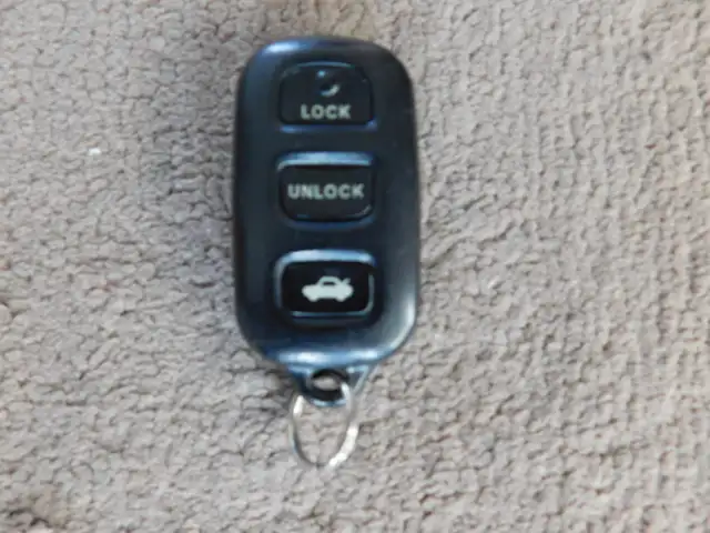 Toyota 4 buttons keyless entry remote FOB.  I do not program