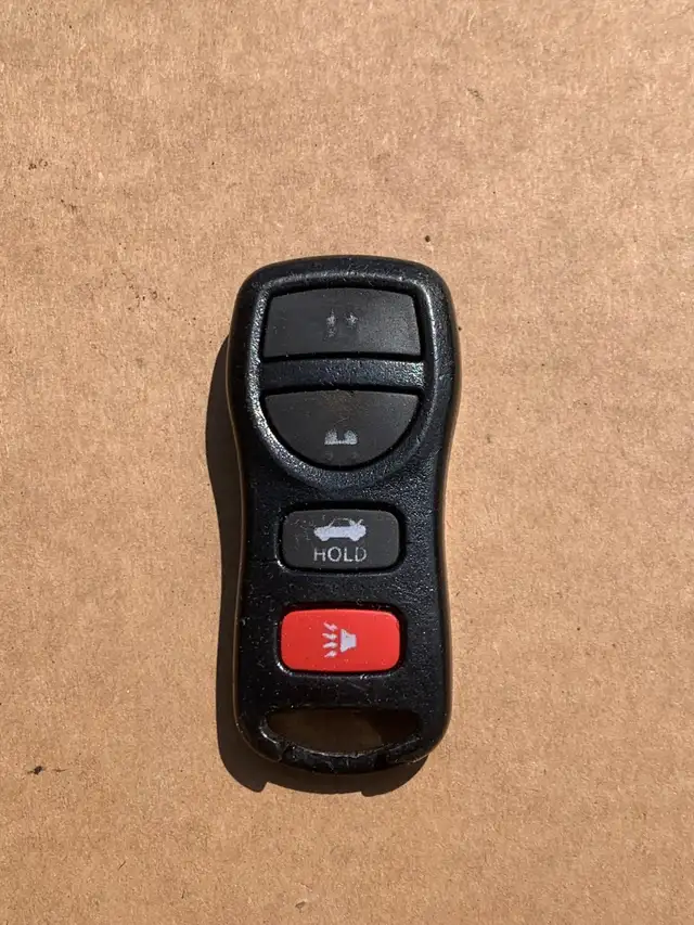 Nissan 4 buttons keyless entry remote FOB.  I do not program.
