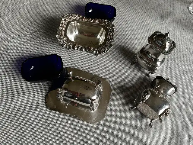 4- pieces cruet set with blue liners $70.00