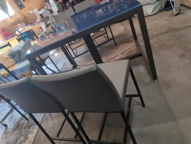 Glass top table and four chairs