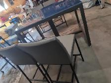 Glass top table and four chairs