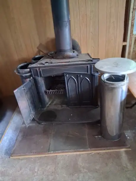 Cast-iron wood stove and Old school desk