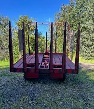 $4500.  hay stacker   new holland 1033 square bale wagon