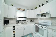 RENOVATED 2 BEDROOM BUNGALOW W/ AN INSULATED GARAGE - Photo 2