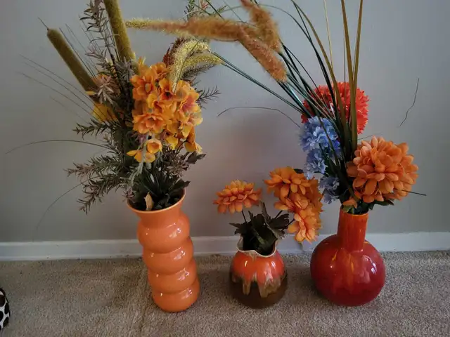 MID CENTURY VASES WITH FLOWERS INCLUDED.
