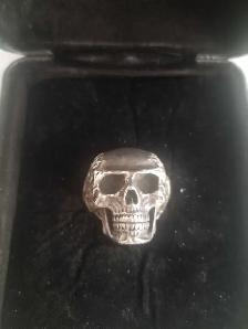 Travis Barker clocks and color sterling silver skull ring