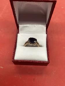 bague en or avec pierre noire