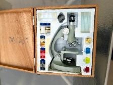 ONE HARDLY USED TASCO ZOOM 50-1200 STUDENT MICROSCOPE