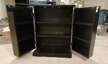 A black wooden storage cabinet featuring multiple open compartme