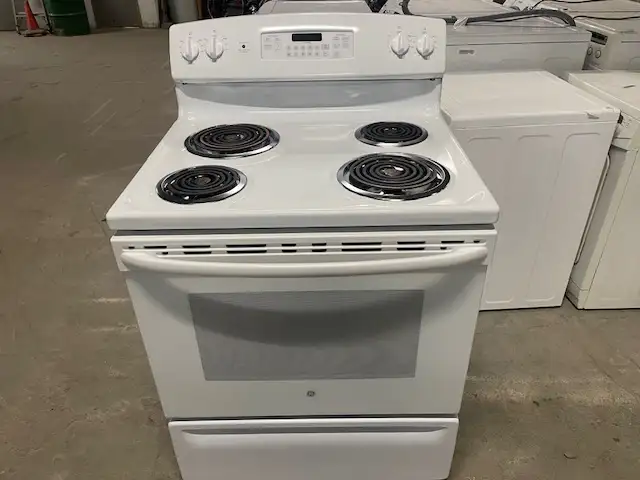Cuisinière blanche ronds serpentins GE