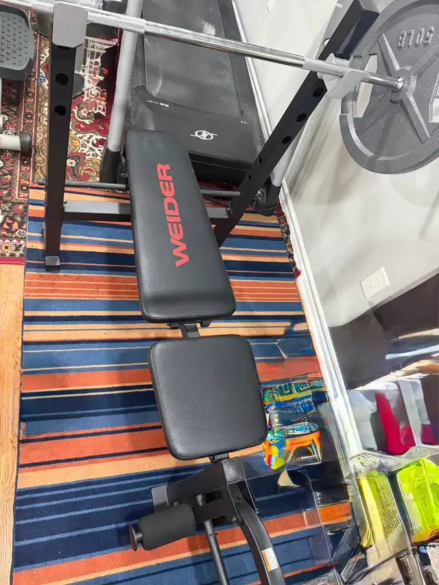 Weider Weight Bench with Barbell and Plates