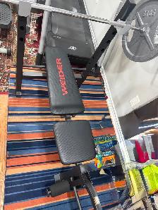 Weider Weight Bench with Barbell and Plates