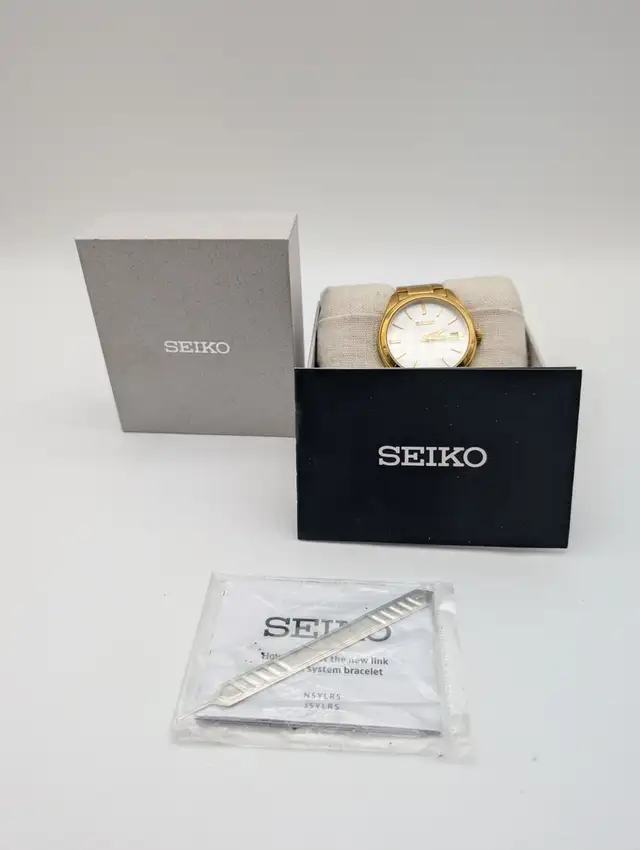 (B8682) Seiko 6N52 Gold Tone White Dial Sapphire Date Quartz...