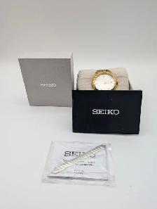 (B8682) Seiko 6N52 Gold Tone White Dial Sapphire Date Quartz...