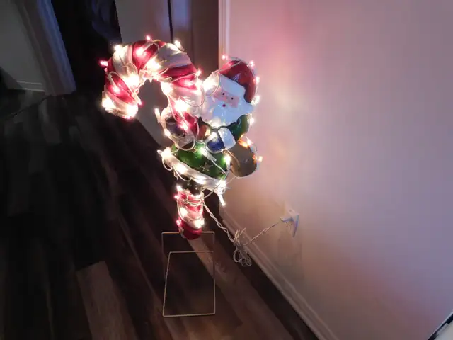 Santa Clause on its own stand with Lights . Christmas Decoration