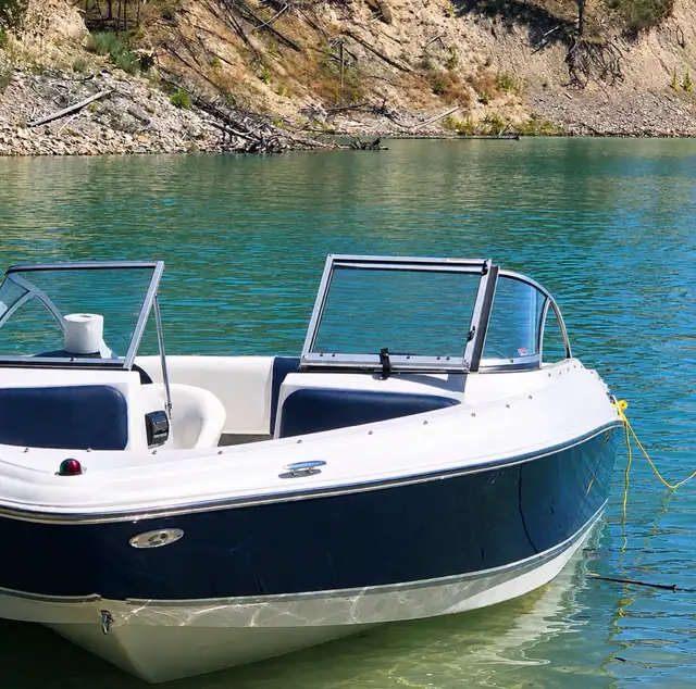 Clean wash and wax outside an 18’ boat