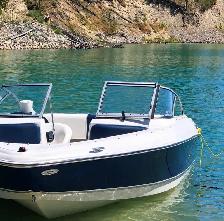 Clean wash and wax outside an 18’ boat
