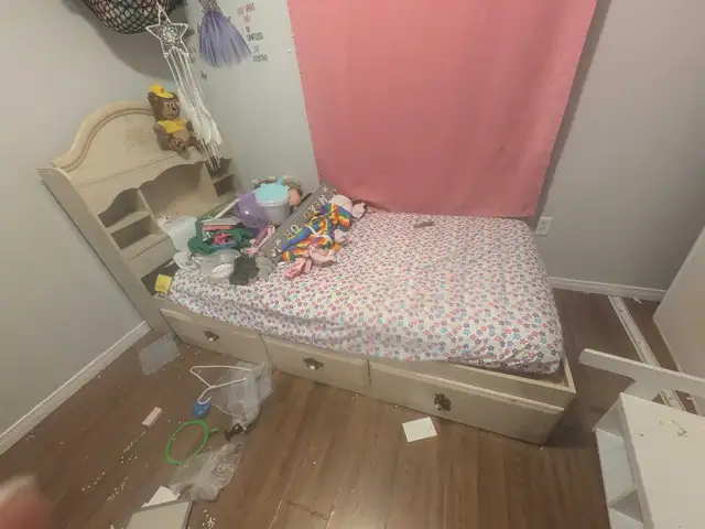 bed with shelves and drawers