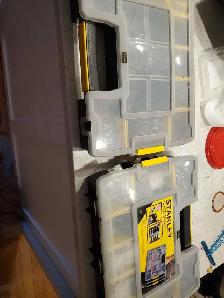 Two full Stanley storage containers for nails and screws