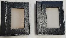Two photo albums with black covers.