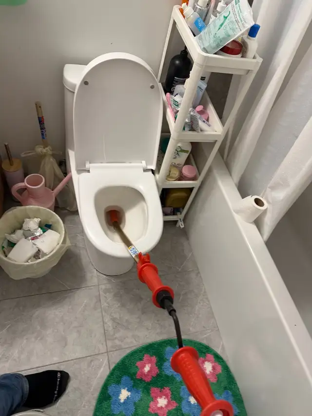 Unclogging Toilet
