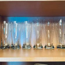 Seven (7) glasses, slender, tall, perfect for an ice-cold beer