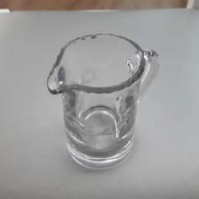 BEAU CRÈMIER NEUF EN VERRE ÉPAIS 4'HAUT DÉCORÉ À FLEURS: $10.00