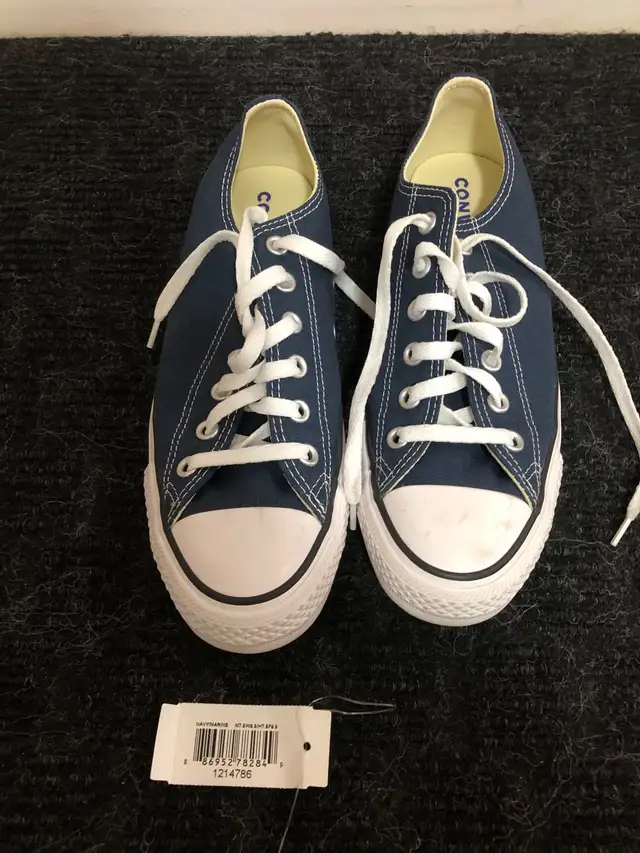 2 pairs of converse chuck taylor shoes. $50 each. Navy are men’s