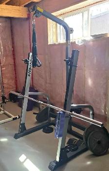 Nautilus Squat Rack with pulley system and Olympic weight
