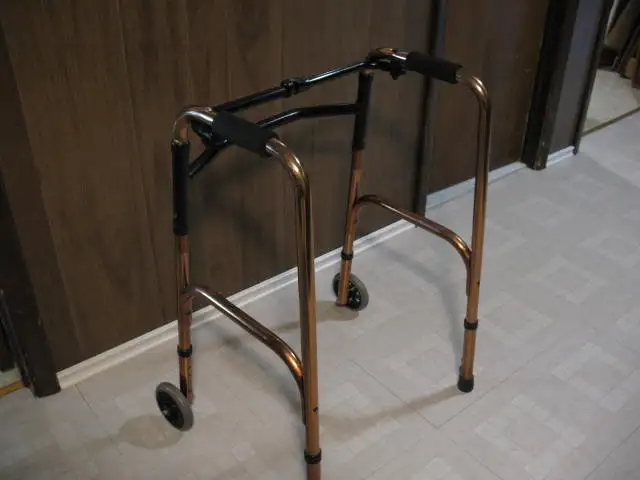 Brass Colored Adjustable Walker with 2 Front Wheels