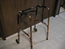 Brass Colored Adjustable Walker with 2 Front Wheels