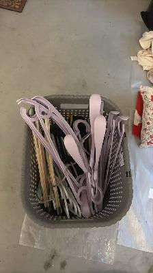 a bunch of  clothes hangers -  used