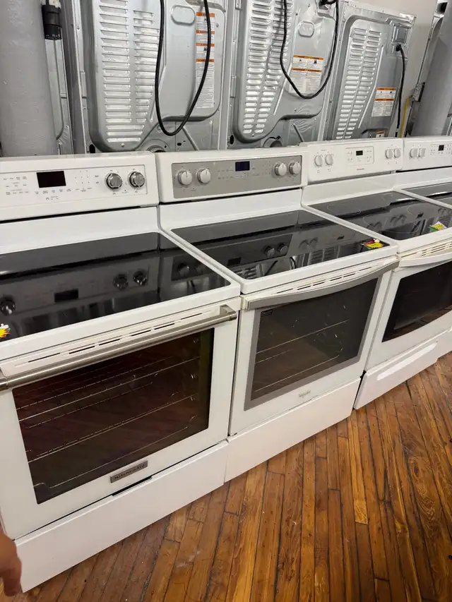White glass top and coil top stoves