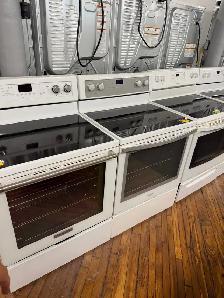 White glass top and coil top stoves