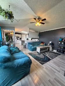 Well-Maintained Mobile Home with Fenced Yard - Photo 2