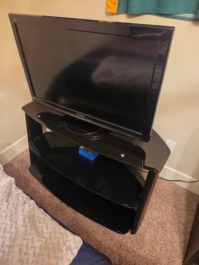 Panasonic TV and glass stand